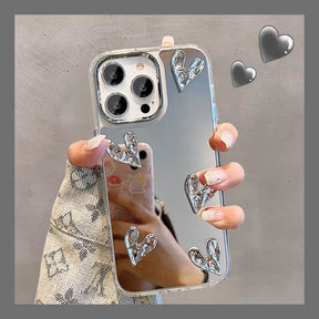 Telefoonhoesje met ingebouwde spiegel en zilverkleurig hartdetail